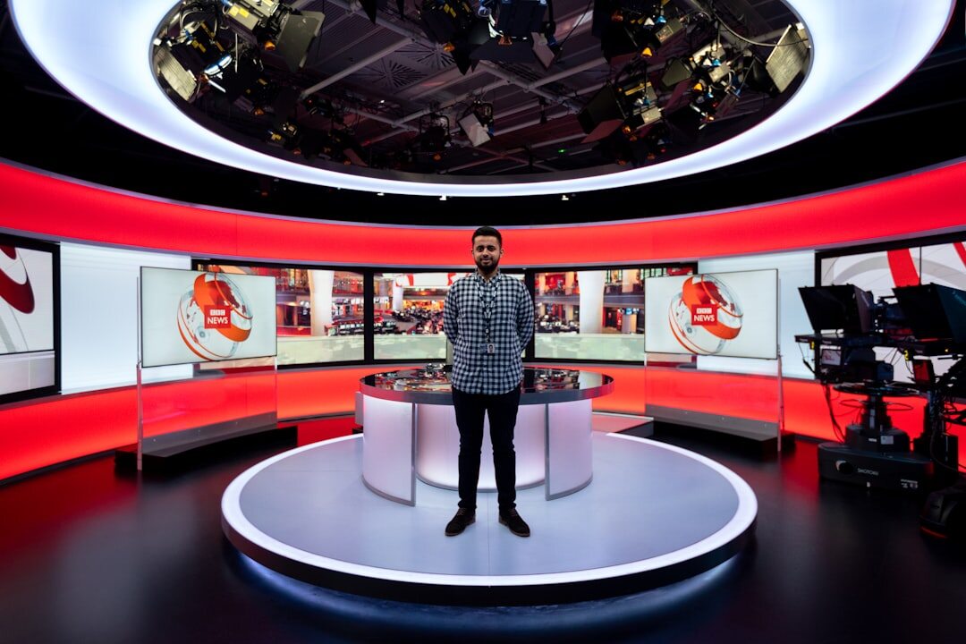News studio set with anchor desk and cameras