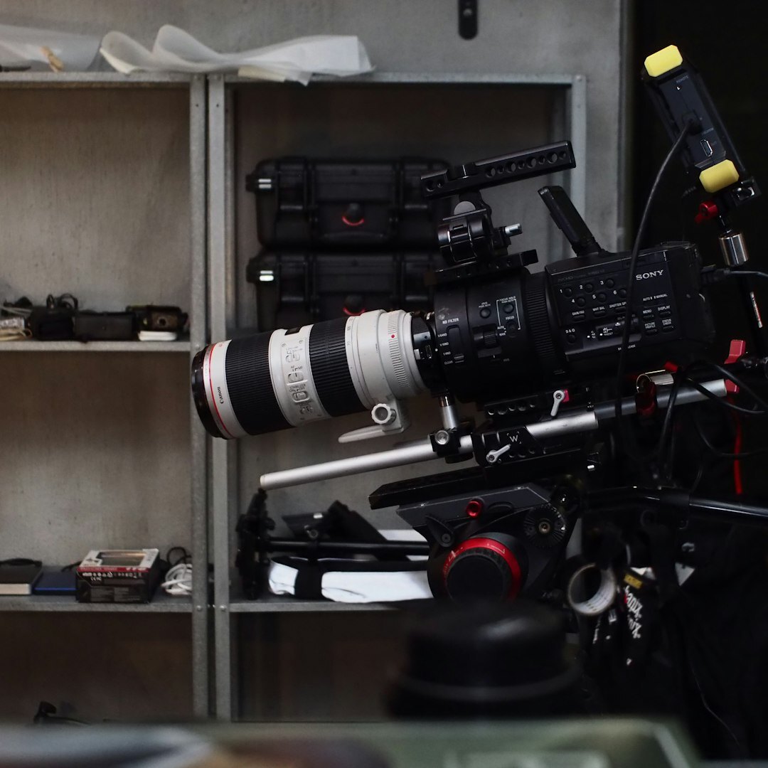 Camera operator filming with a professional broadcast camera