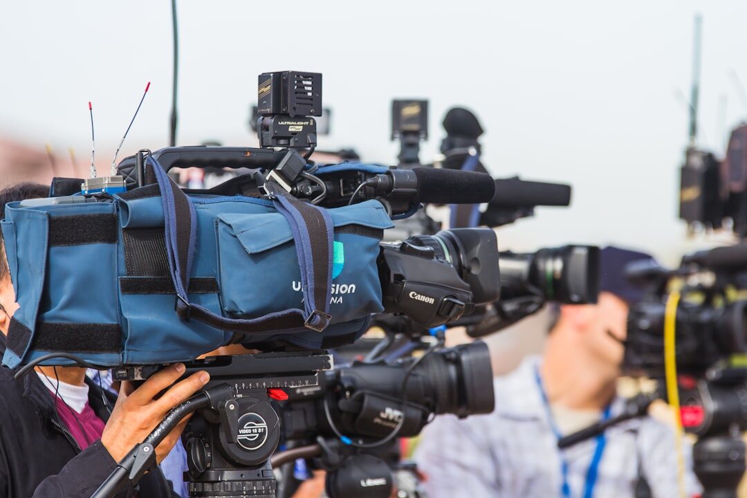 Broadcast team preparing equipment before a live news segment
