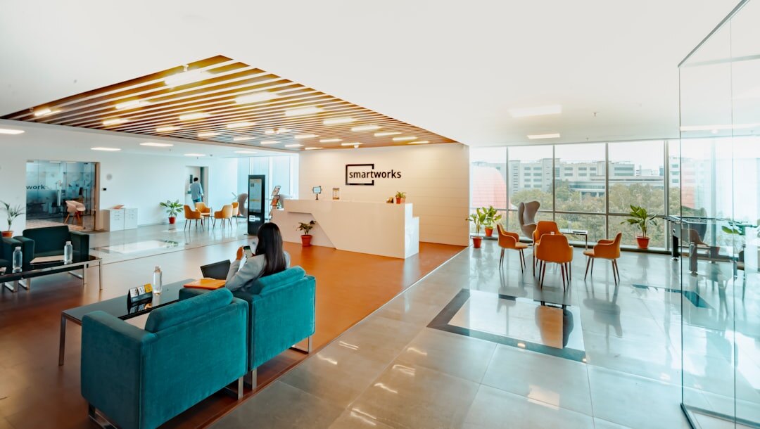 Modern media company office reception with screens
