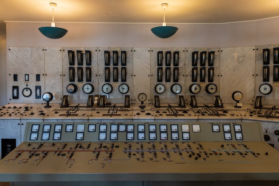 Broadcast control room with operators monitoring live video feeds