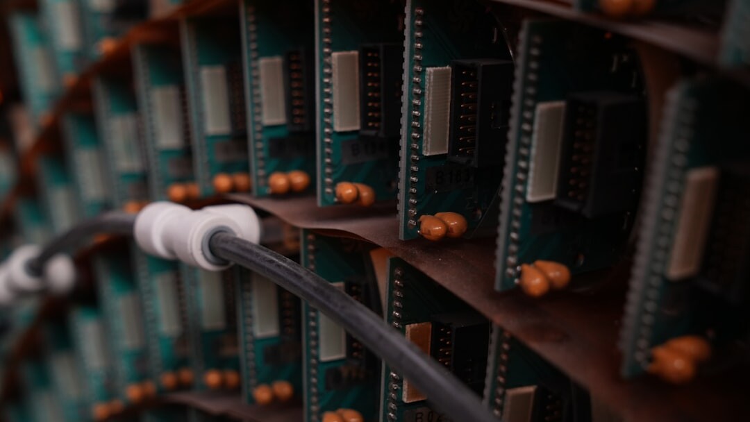 Technicians routing broadcast signal cables in a server rack